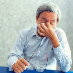 Older gentleman suffering from sinus headache